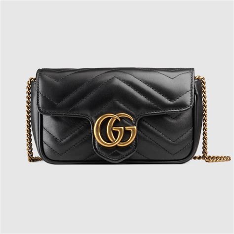 .gg/gucci|GG Emblem super mini bag in pale green leather .